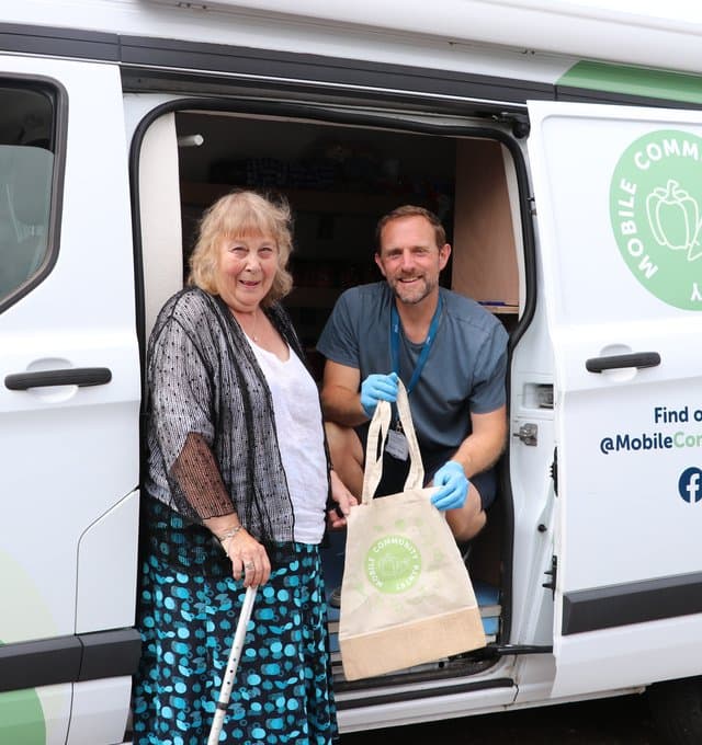 Bobby Tait with mobile community pantry customer
